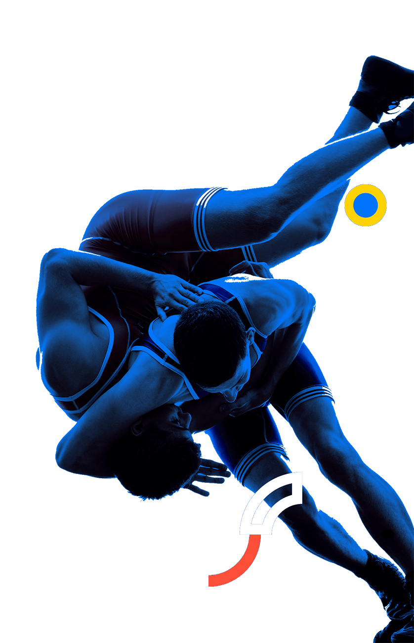 En la foto, un luchador aplicándole una maniobra con la que hacer caer al suelo a su oponente.