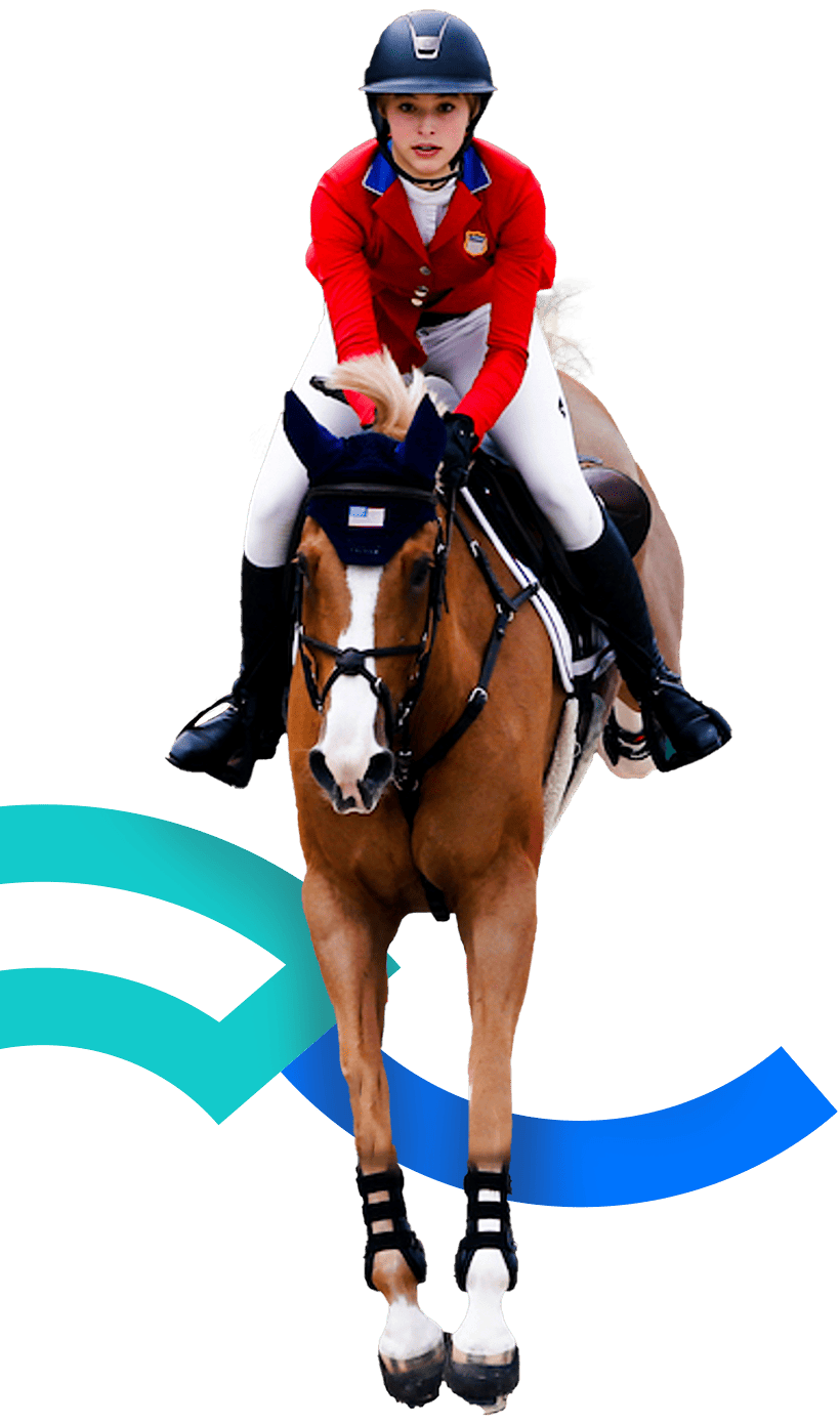 En la foto una jinete montando su caballo tras realizar un salto.